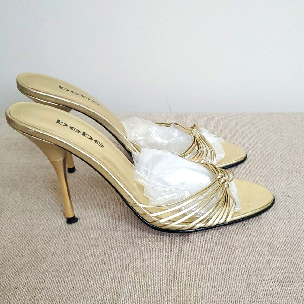 Woman's Bebe 6 1/2 m gold sandals high